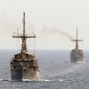 Which countries will send warships through the Strait of Hormuz by August 31?